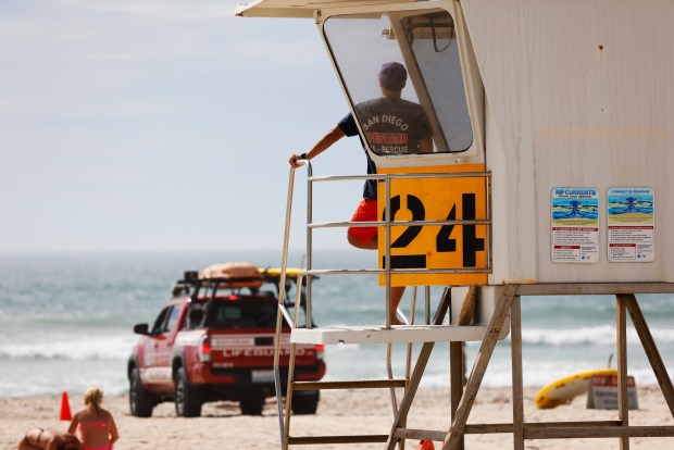 San Diego, CA - September 7: A San Diego lifeguard looks over Pacific Beach on Labor Day as large surf generated by Hurricane Marie slams the Southern California coast on September 7, 2026 in San Diego, CA. (K.C. Alfred / The San Diego Union-Tribune)