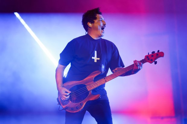 Bassist Preciado of Pierce the Veil performs with the band Saturday at Petco Park. (Meg McLaughlin / The San Diego Union-Tribune)