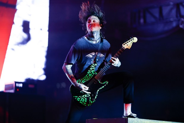 Lead guitarist Tony Perry of Pierce The Veil was an energetic presence at the band's Saturday concert at Petco Park/ (Meg McLaughlin / The San Diego Union-Tribune)