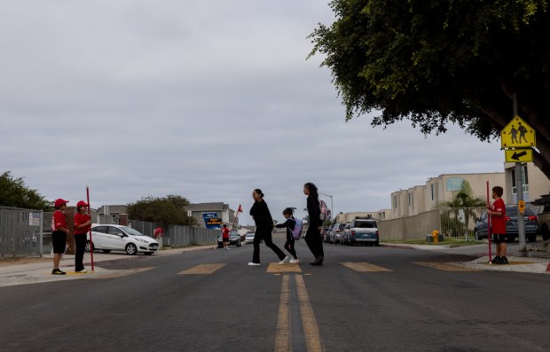 Parents walk their children to Berry Elementary School on Thursday, Sept. 12, 2024 in San Diego, California. (Ana Ramirez / The San Diego Union-Tribune)
