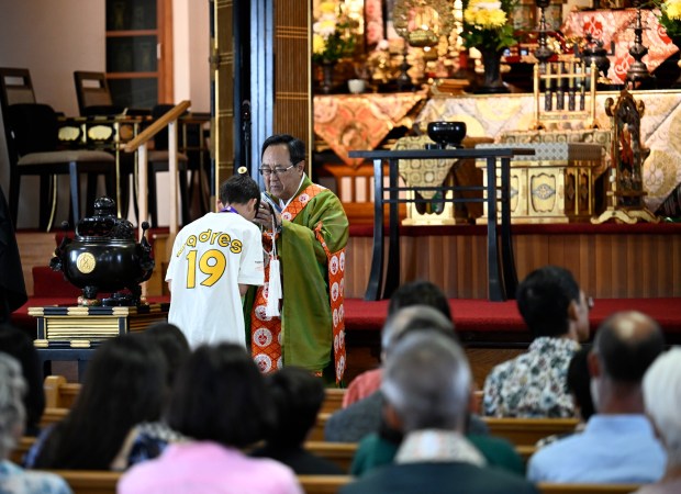 Rev. Marvin Harada gives a blessing during a Buddhist naming ceremony at The Buddhist Temple of San Diego as part of their 100th anniversary celebration Sept. 20, 2026 in San Diego, Calif. (Photo by Denis Poroy)