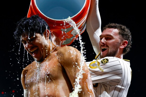 Jackson Merrill #3 douses Ethan Salas #8 of the San Diego Padres after Salas' walk-off single against the Miami Marlins during the tenth inning at Petco Park on Saturday, Sept. 19, 2026 in San Diego, California. (Meg McLaughlin / The San Diego Union-Tribune)