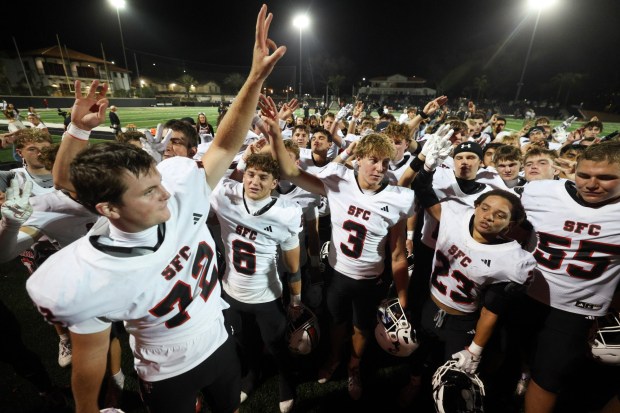 CARLSBAD, CA - September 18, 2026: Santa Fe Christian players celebrate after beating Army and Navy Academy 56-0 at the Army and Navy Academy in Carlsbad on Friday, September 18, 2026. (Hayne Palmour IV / For The San Diego Union-Tribune)
