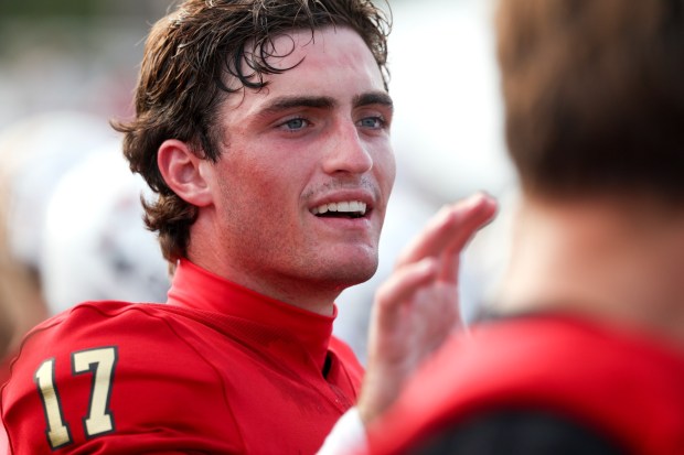Santa Fe Christian quarterback Dax Labrum on the sidelines with teammates during the second half against Helix at the Santa Fe Christian School in Solana Beach on Friday, August 21, 2026. (Hayne Palmour IV / For The San Diego Union-Tribune)