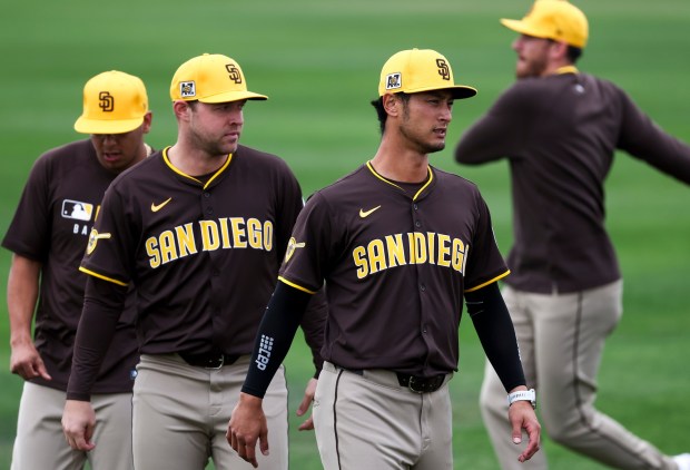 Bradgley Rodriguez, Michael King, Yu Darvish and Joe Musgrove stretch during Padres spring training workouts at the Peoria Sports Complex on Wednesday, Feb. 12, 2025 in Peoria, Ariz.. (Meg McLaughlin / The San Diego Union-Tribune)