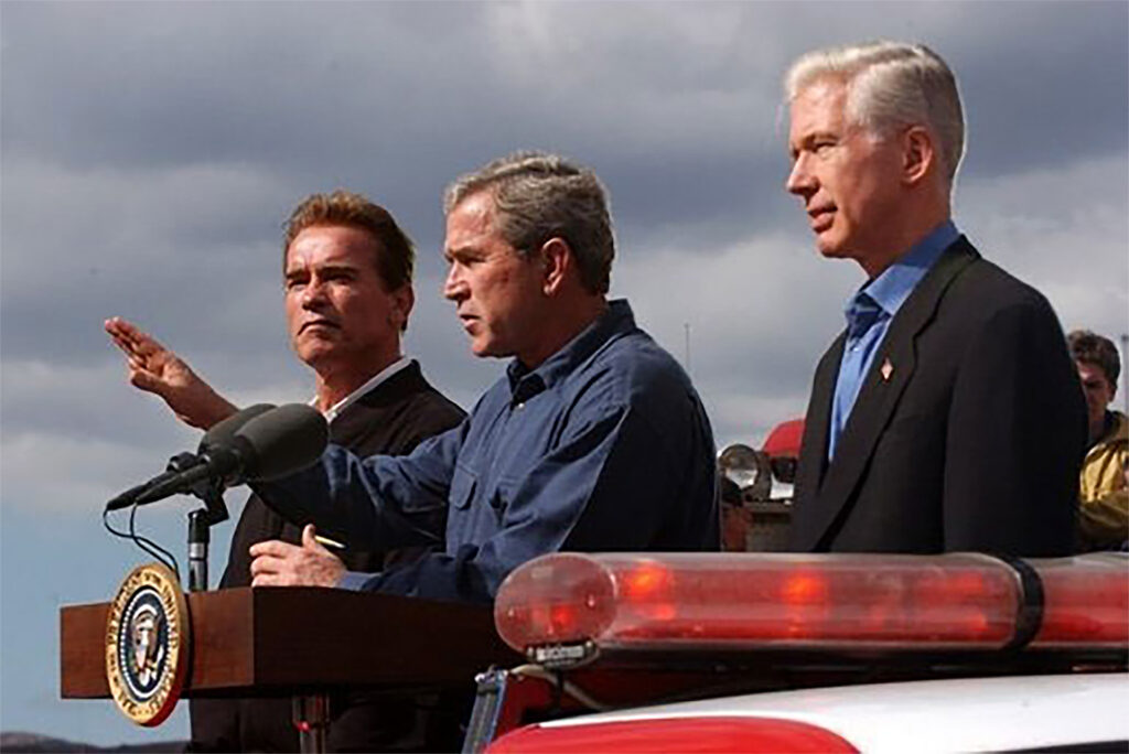 President George W. Bush, center, is flanked by governor-elect Arnold Schwarzenegger (left) and outgoing-Governor Gray Davis, right.