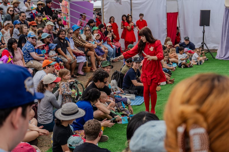 Puppeteer interacting with crowd at the 2nd puppet show of the day.