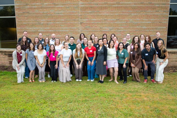 New Troy schools staff pose for a group photo before the start of the new school year. Hundreds of new staff and administrators will be starting in new districts around the county this fall.Photo courtesy TSD