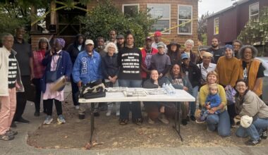 Zakiya Jendayi, center, surrounded by supporters at the weekly gathering at her house to halt her eviction. Photo by Tanya Dennis.