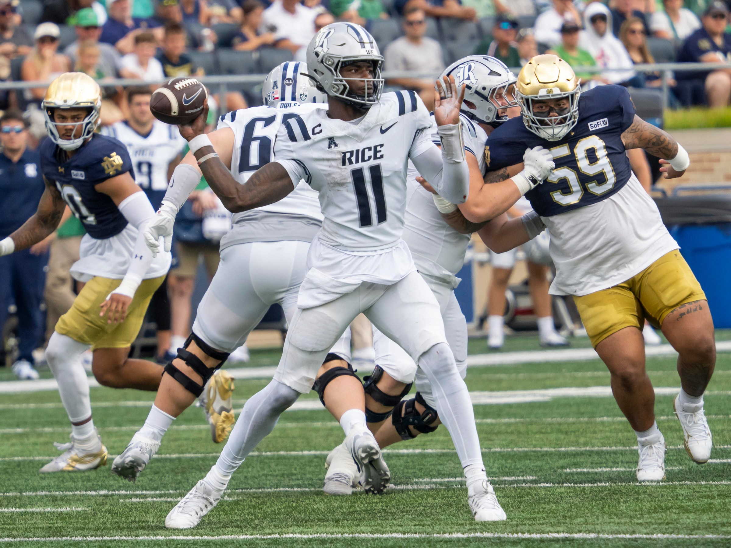 SOUTH BEND, IN - SEPTEMBER 12: Rice Owls quarterback Jacurri Brown (11) passes the ball to his teammate during the game between the Rice Owls and the Notre Dame Fighting Irish on September 12, 2026 at Notre Dame Stadium in South Bend, Indiana. (Photo by Joseph Weiser/Icon Sportswire via Getty Images)