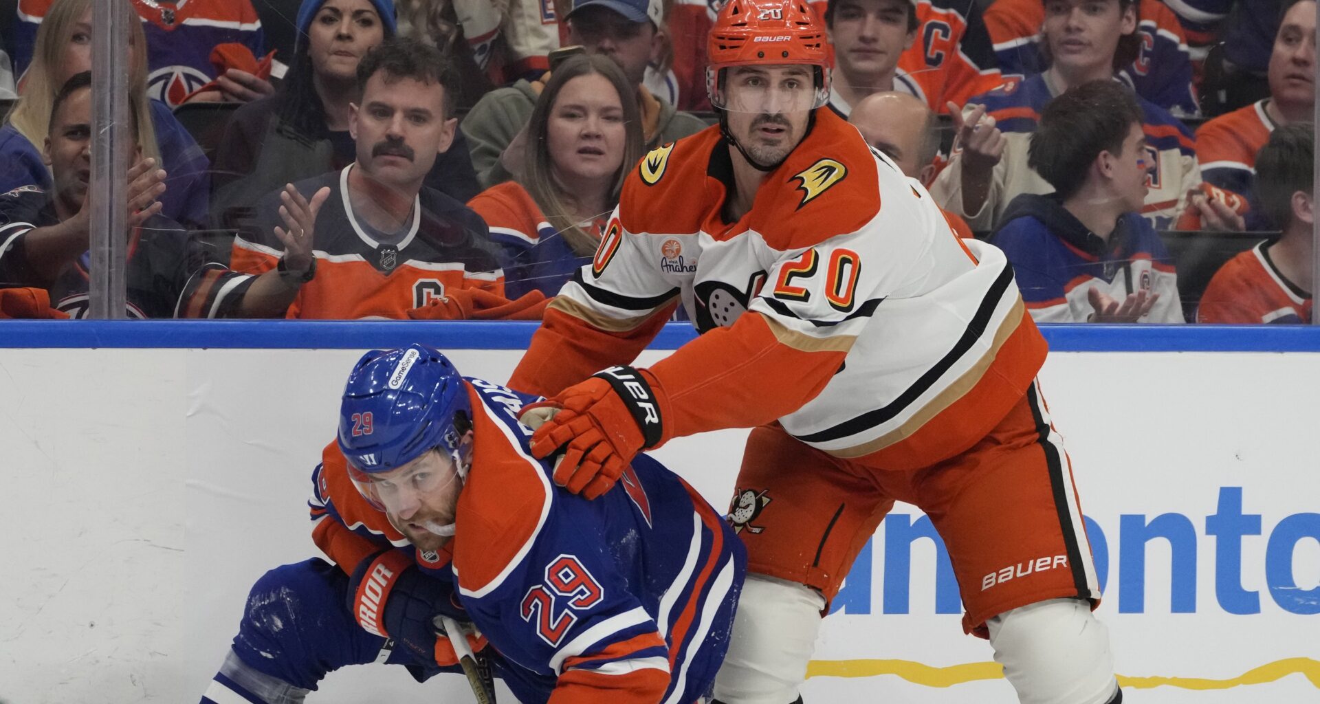 Edmonton Oilers Leon Draisaitl (29) is pushed to the ice by Anaheim Ducks Chris Kreider (20) during the second period of game 5 in the first round of an NHL hockey Stanley Cup playoff series on Tuesday, April 28, 2026 in Edmonton. Greg Southam-Postmedia