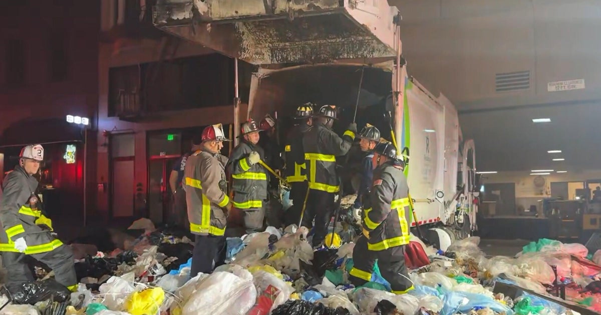 San Francisco firefighters rescue person trapped inside garbage truck