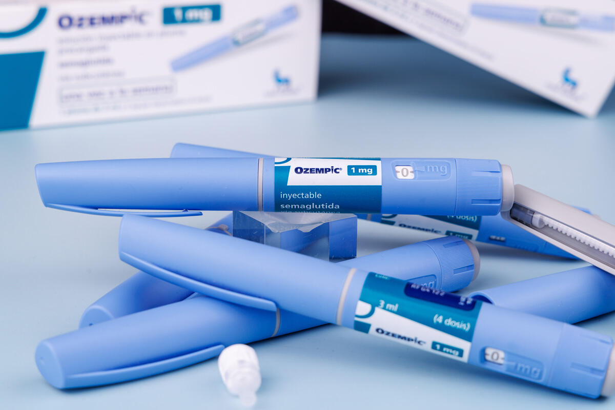 A pile of blue, injectable medication with the Ozempic name on it.