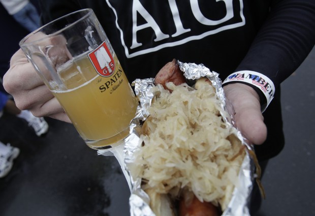 William Warrior of Mountain View holds his beer, sauerkraut and polish dog during Oktoberfest in Campbell on Oct. 17, 2010. Campbell celebrated its 16th annual Oktoberfest festival held in downtown Campbell. (Gary Reyes /Mercury News)