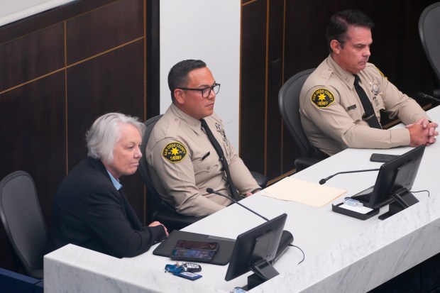 San Diego County Sheriff Kelly A. Martinez (left) listens to public comments after she made her presentation at the Board of Supervisors meeting on Tuesday, Sept. 1, 2026, in San Diego. (Nelvin C. Cepeda / The San Diego Union-Tribune)
