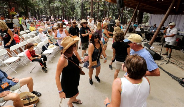 Audience members dance at a music festival in Idyllwild. SCNG