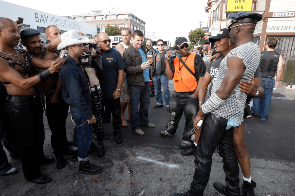 \u200bFestivalgoers admire and photograph attendees dressed in fetish gear at Folsom Street Fair in San Francisco.