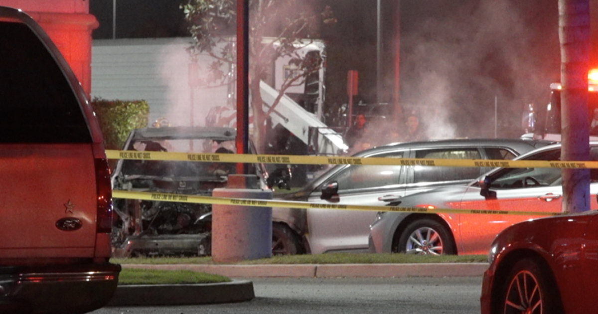 2 vehicles smoldering at Bakersfield hotel parking lot
