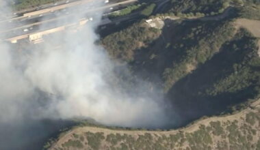Brush fire off 405 threatens homes and Getty Center