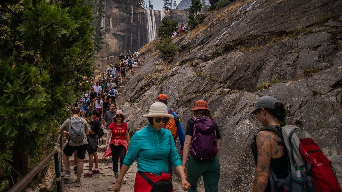 Visitors hike the Mist Trail toward Vernal Falls in Yosemite National Park.