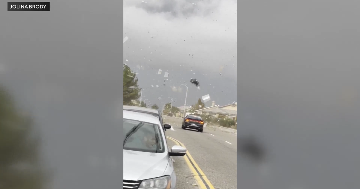 Possible landspout sends Victorville trash cans and debris flying