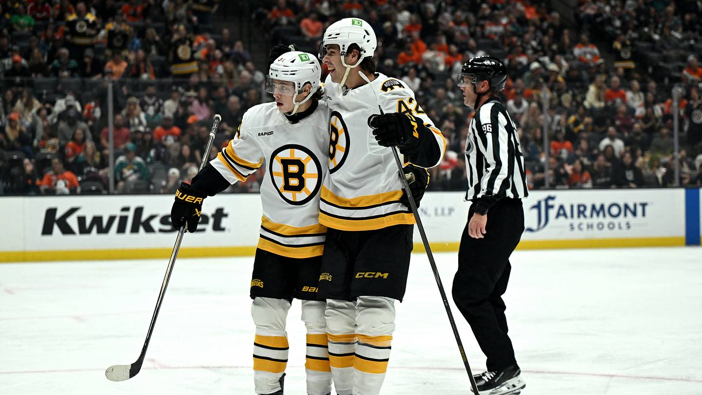 Oct 16, 2026; Anaheim, California, USA;  Boston Bruins defenseman Frederic Brunet (42) celebrates after scoring a goal with center James Hagens (44) against the Anaheim Ducks during the second period at Honda Center.  Mandatory Credit: Griffin Hooper-Imagn Images