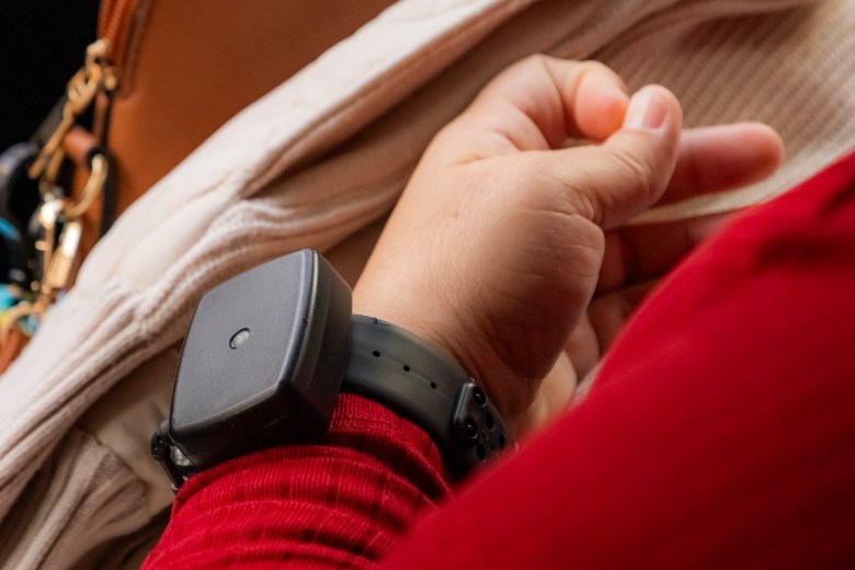 A San Francisco educator wearing a black square wearable device on a black wristband.