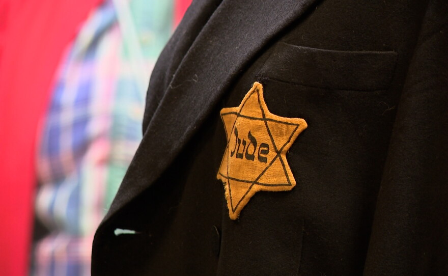 A black jacket emblazoned with a yellow Star of David and the word "Jude," meaning "Jew" in German, is displayed at the RUTH exhibit at the Central Library on Sept. 8, 2026.