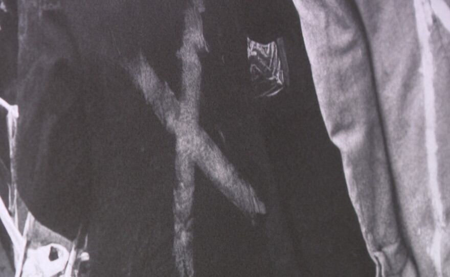 A garment with an "X" painted on the back is shown at the RUTH exhibit at the Central Library on Sept. 8, 2026.