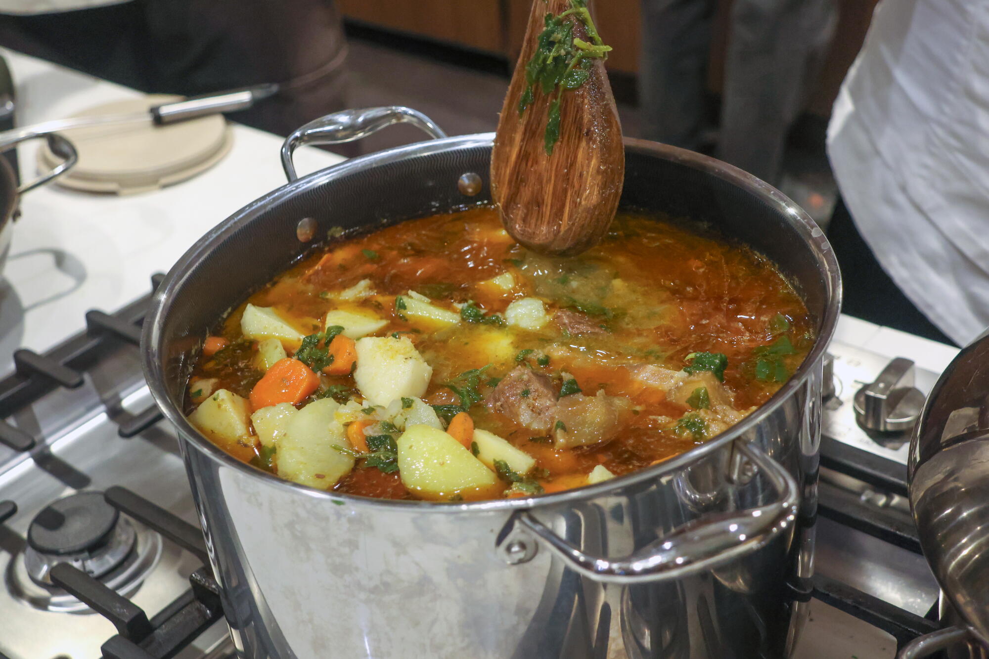 Bouyon, a Haitian stew with meat and vegetables, is known for its healing properties.