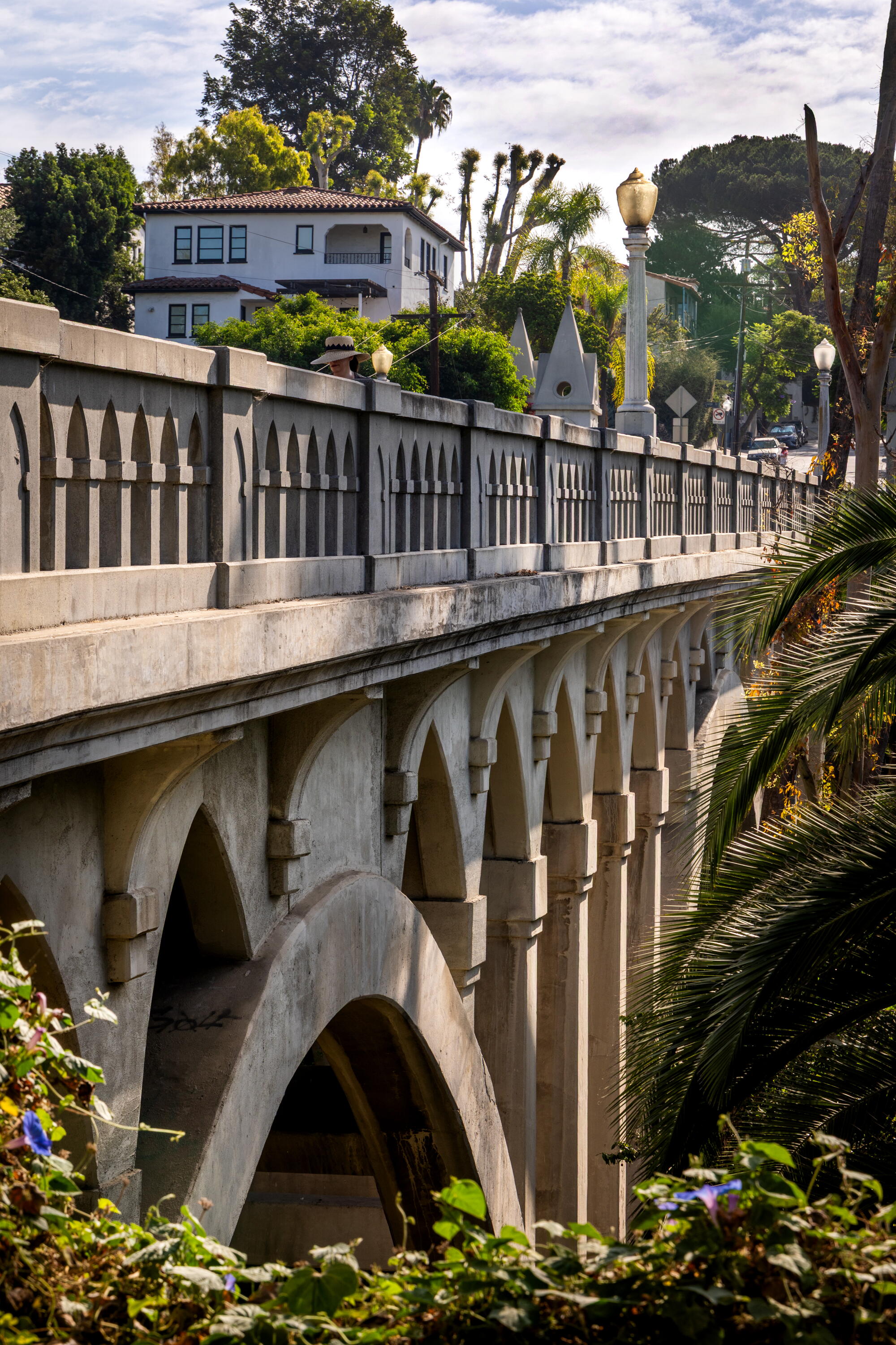 A pedestrian crosses the Shakespeare Bridge.