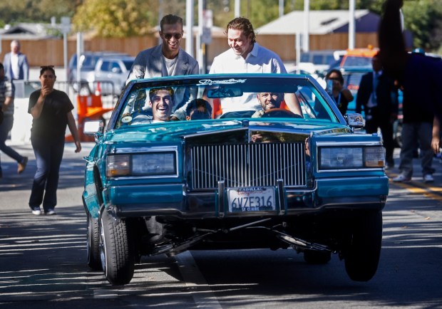 San Jose Sharks' Alexander Wennberg (21), top left, San Jose Sharks' Tyler Toffoli (73), top right, and San Jose Sharks' Mason Marchment (27), bottom left, ride in a lowrider from the United Lowrider Council of San Jose during the Teal Carpet arrivals before their first home game against the Florida Panthers at the SAP Center in San Jose, Calif., on Thursday, Oct. 1, 2026. (Nhat V. Meyer/Bay Area News Group)