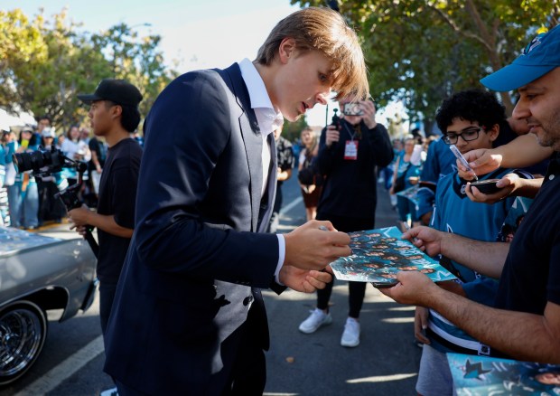 San Jose Sharks' Ivar Stenberg (41) signs autographs during the Teal Carpet arrivals before their first home game against the Florida Panthers at the SAP Center in San Jose, Calif., on Thursday, Oct. 1, 2026. (Nhat V. Meyer/Bay Area News Group)