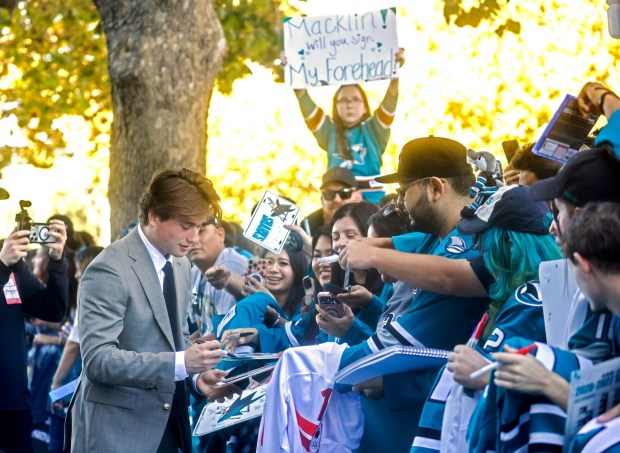 San Jose Sharks' Macklin Celebrini (71) signs autographs during the Teal Carpet arrivals before their first home game against the Florida Panthers at the SAP Center in San Jose, Calif., on Thursday, Oct. 1, 2026. (Nhat V. Meyer/Bay Area News Group)