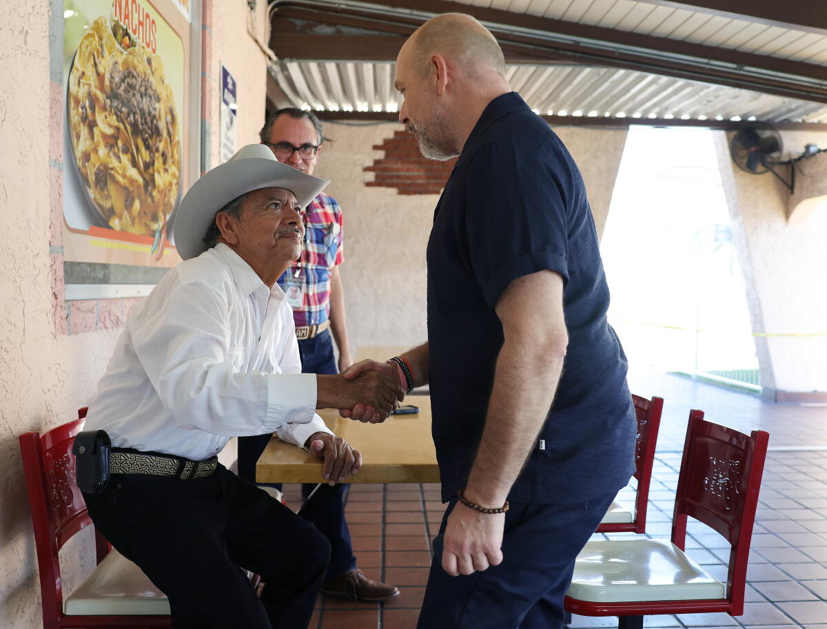 Gubernatorial candidate Steve Hilton greets Lorenzo Arellano.