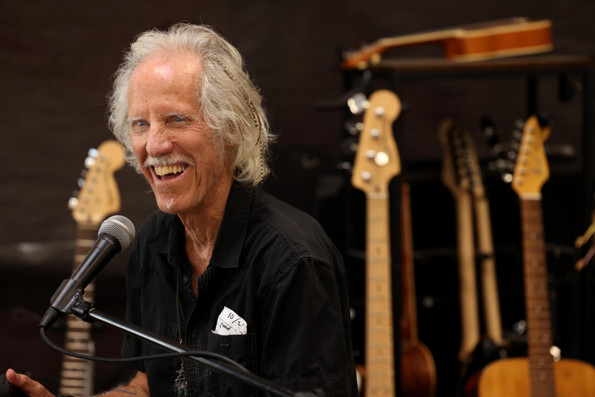 John Densmore enjoys an upbeat moment while teaching a music class at Homeboy Art Academy.
