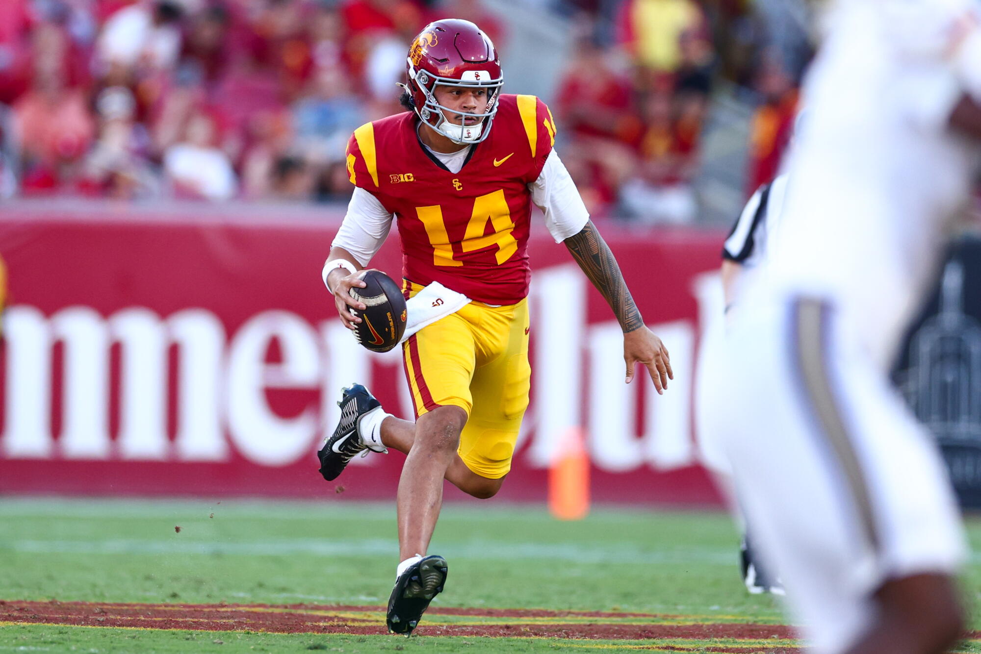 USC quarterback Jayden Maiava scrambles during the first half against Washington at the Coliseum.