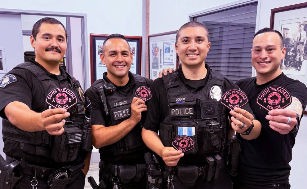 officers holding pink patches