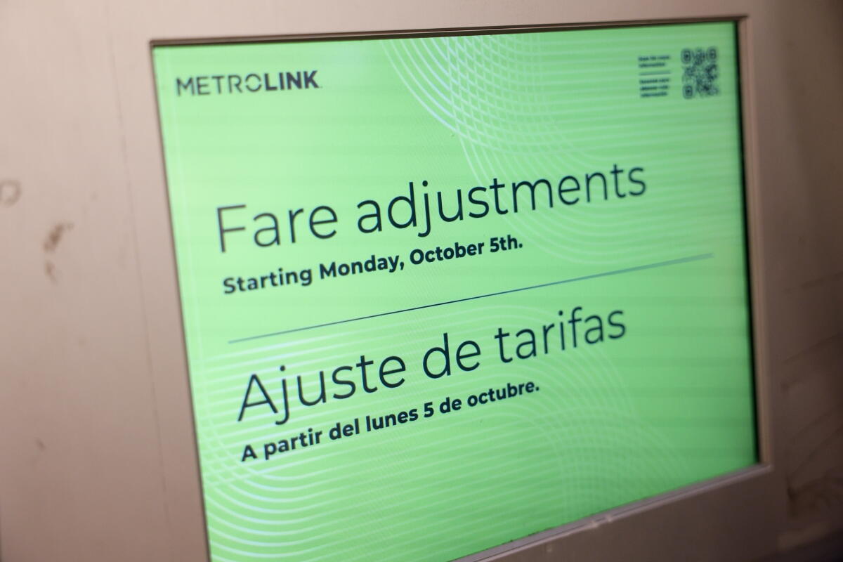 A screen display on a ticketing booth says "Fare adjustments."