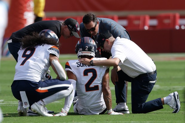 Denver Broncos cornerback Pat Surtain II (2) is tended to during the first half of an NFL football game against the San Francisco 49ers in Santa Clara, Calif., Sunday, Oct. 4, 2026. (AP Photo/Kelley L. Cox)