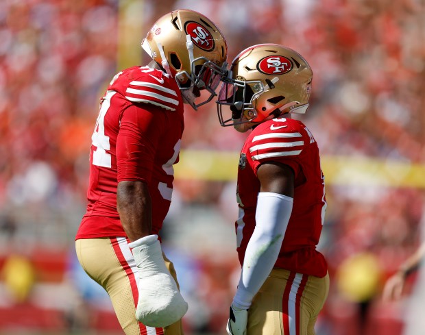 San Francisco 49ers' Malik Mustapha (6) celebrates a play with San Francisco 49ers' Romello Height (94) against the Denver Broncos in the second quarter at Levi's Stadium in Santa Clara, Calif., on Sunday, Oct. 4, 2026. (Nhat V. Meyer/Bay Area News Group)