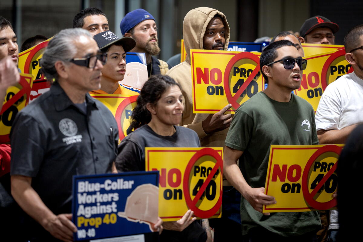 People attend a rally against Proposition 40 at the Iron Workers Apprenticeship Training Center.