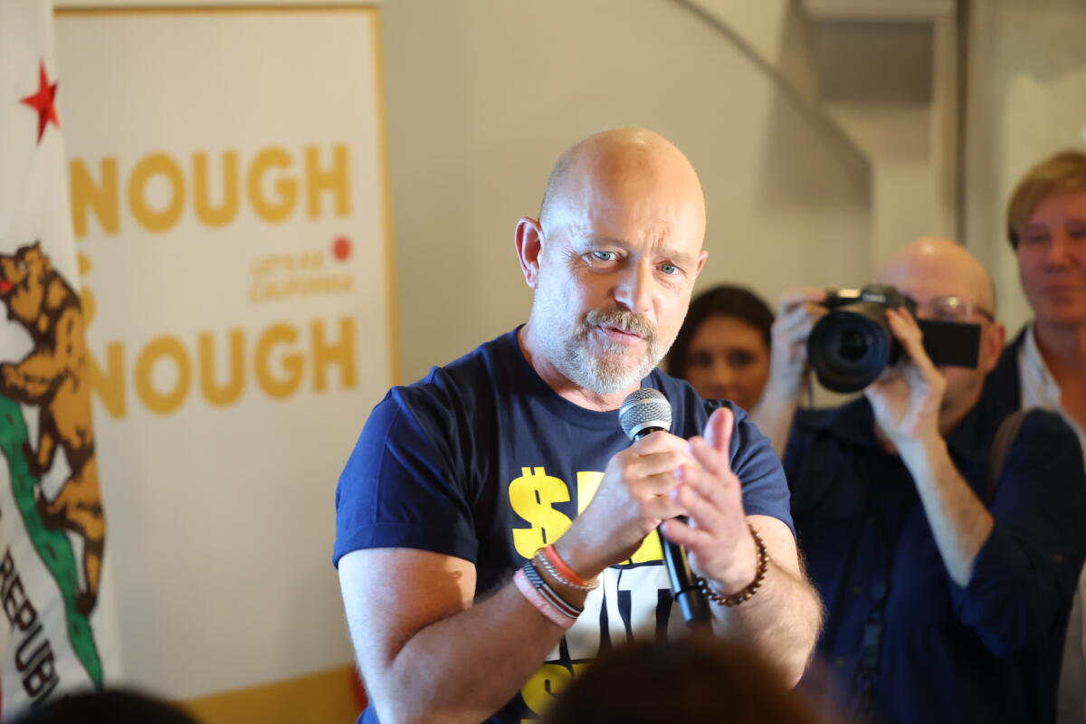 Steve Hilton with a microphone