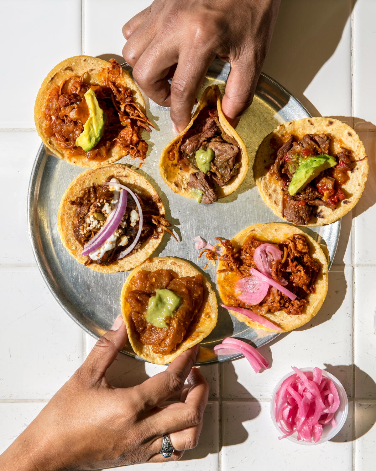 Above, a taco sampler from the original Guisados in Boyle Heights
