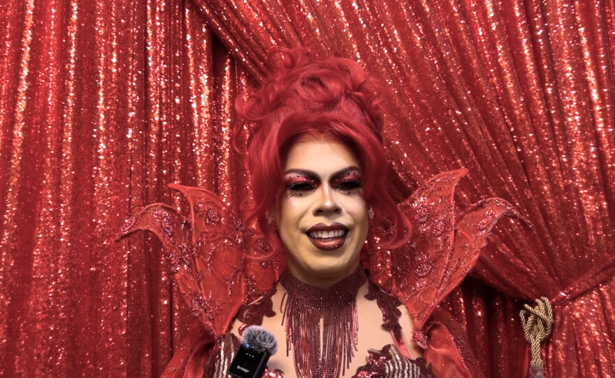 Crystal Bullet wears a high color ensemble with matching red make up at Lips San Diego on Oct. 6, 2026.
