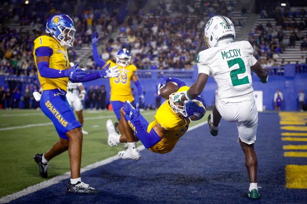 San Jose State Spartans' Caleb Womack (32) intercepts a pass intended for Cal Poly Mustangs' Tayvion McCoy (2) during the fourth quarter at CEFCU Stadium in San Jose, Calif., on Saturday, Sept. 12, 2026. (Shae Hammond/Bay Area News Group)