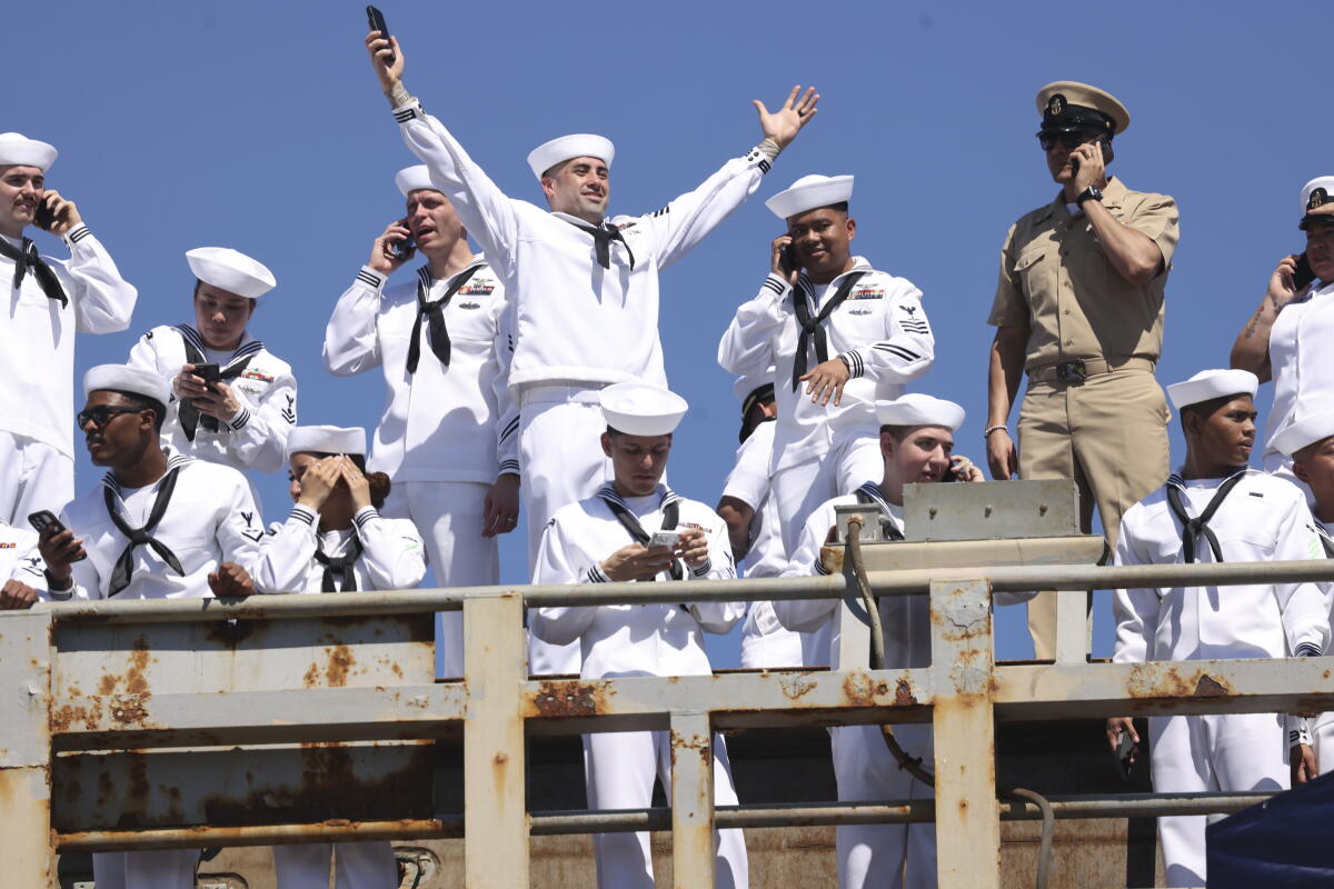 Sailors wave to their loved ones aboard the USS Abraham Lincoln arrived at North Island Naval Air Station.
