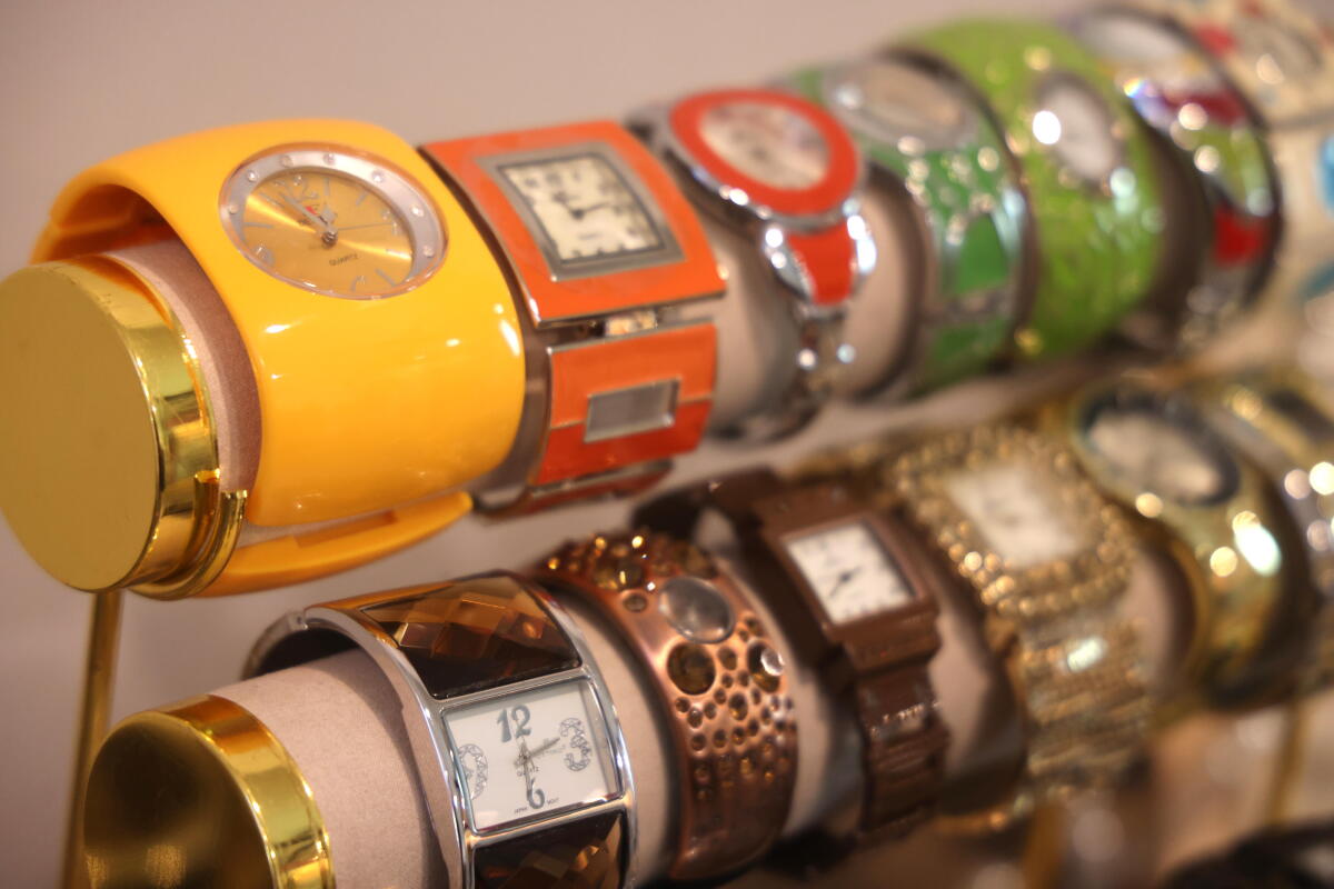 About a dozen watches are wrapped around two display bars.