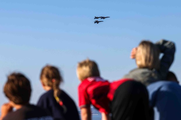 Spectators watch the U.S. Navy Blue Angels fly over the San Francisco Bay during a practice flight for San Francisco Fleet Week, as seen from Treasure Island in San Francisco, Calif., on Thursday, Oct. 8, 2026. (Ray Chavez/Bay Area News Group)