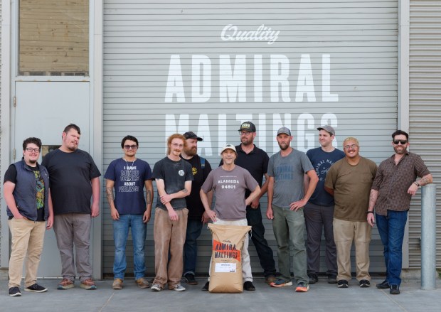 A group photo of Admiral Maltings Co-founders and employees during the last day of operation in Alameda, Calif. on October 2nd, 2026. Pictured from left are Noah Cachuela, Milo Benjamine, Brandon Balassi, Sam Silberstein, Tim Decker, Ron Silberstein, Zack Reinstein, Curtis Davenport, Derek Timm-Brock, Diego Salinas, and Thomas Brenkwitz.(Douglas Despres for Bay Area News Group)